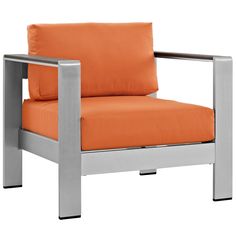 an orange chair sitting on top of a white floor next to a metal frame and pillow