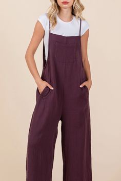 Embrace the essence of relaxed style with our Terracotta Overall Jumpsuit! They feature a double gauze fabric and wide leg design. These overalls in a warm brown tone are a comfy and casual look, perfect for any season Material & Care: Made from 100% Cotton Double Gauze. Machine wash cold on a gentle cycle with like colors. Tumble dry low or lay flat to dry. Avoid bleach to maintain the fabric's natural softness. Size & Fit: Model is 5'7" wearing size small Bust: 34C Waist: 24" Hips: 34" Cotton Wide Leg Overalls For Loungewear, Relaxed Fit Wide Leg Overalls For Loungewear, Wide Leg Relaxed Fit Overalls For Loungewear, Brown Relaxed Fit Jumpsuits And Rompers With Pockets, Dark Wash Wide Leg Cotton Overalls, Brown Cotton Relaxed Fit Jumpsuits And Rompers, Brown Cotton Summer Overalls, Brown Cotton Jumpsuits And Rompers For Loungewear, Brown Relaxed Fit Jumpsuit Overall