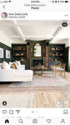 the living room is decorated in green and white with wood trimmings on the walls