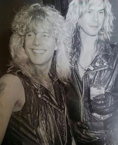 an old photo of two people posing for the camera with one woman wearing a leather jacket