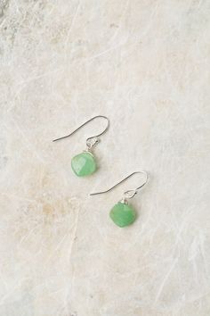 Experience the beauty of these exquisite earrings featuring a sterling silver wire wrapped chrysoprase birthstone. Perfect for those born in May! Sterling Silver (lead and nickel free) Chrysoprase On sterling silver ear wires We hand select our natural materials, thus there may be slight variations in color and/or size that will not detract from the overall aesthetic Our unique handcrafted designer jewelry for women is made in America, with each design created individually in our personal design Wire Wrapped Jade Earrings As Gift, Handmade Silver May Birthstone Earrings, Sterling Silver Dangle Earrings With Birthstone, Jade Wire Wrapped Earrings For Gifts, Nickel-free Chrysoprase Jewelry Gift, Handmade Chrysoprase Dangle Jewelry, Adjustable Silver Chrysoprase Jewelry, Chrysoprase Gemstone Drop Earrings, Flower May