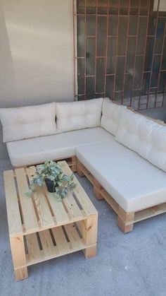 a couch and table made out of wooden pallets