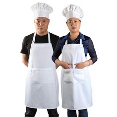 two people standing next to each other wearing white aprons