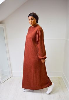 "A winter cosy Chenille Abaya - an exclusive to our winter shop! A relaxed A-Line fit chenille Abaya dress crafted from a soft velvety yarn. Designed with a round neck and slim balloon elastic sleeves. This plain Jane cut and fabric will have you feeling warm and looking super trendy. One size to fit 12-16. No Hijab/Belt included, Model styles with Beige jersey Hijab Chest 24.5\" | Waist 24.5\" | Length 56\"" Winter Cosy, Jersey Hijab, Elastic Sleeves, Plain Jane, Abaya Dress, Dress Crafts, Brick Red, Clothing Items, Fashion Models