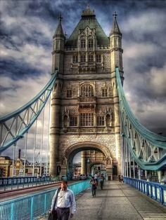 the tower bridge is very tall and has many windows