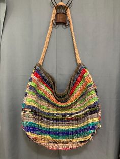 Handmade woven bags, boho market  sizes vary between 22x16, 19x16 recycle and natural materials fringe or no fringe Straps vary from cotton strap, or hemp rope, Casual Handwoven Jute Hobo Bag, Casual Handwoven Shoulder Bag For Festivals, Bohemian Jute Shoulder Bag, Bohemian Woven Shoulder Beach Bag, Bohemian Jute Shoulder Bag For Everyday Use, Bohemian Bucket Bag With Adjustable Strap In Jute, Bohemian Jute Shoulder Bag With Adjustable Strap, Bohemian Jute Bucket Bag With Adjustable Strap, Bohemian Multicolor Handwoven Hobo Bag