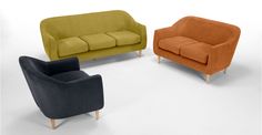 three different colored couches sitting next to each other