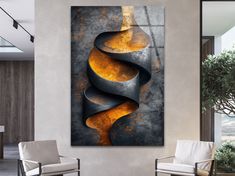 an abstract painting on the wall in a living room