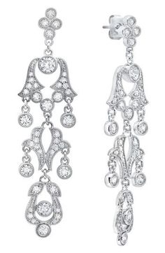 Andrew Prince's regal design DNA is infused into every part of these luxe drop earrings featuring milgrain detailing and brilliant-cut crystals. 2 5/8" drop; 1/2" width Hypoallergenic Rhodium plate/crystal Imported Classic Pierced Chandelier Earrings For Formal Occasions, Classic Drop Chandelier Earrings With Diamond Accents, Classic Diamond Chandelier Earrings With Diamond Accents, Classic Formal Chandelier Earrings With Intricate Design, Classic Filigree Dangle Chandelier Earrings, Luxury Drop Chandelier Earrings With Intricate Design, Classic Filigree Chandelier Earrings, Classic Filigree Chandelier Dangle Earrings, Luxury Intricate Design Drop Chandelier Earrings