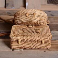 This woven rattan crossbody handbag is unique and chic. The shoulder straps are made of leather, adding a touch of luxury, and the bag itself is intricately woven to create a one-of-a-kind look. It's perfect for carrying all your essentials while adding a touch of nature to your outfit. 100% Handcrafted, Natural, Unique, and Chic. Leather shoulder straps length: 60" Size: 7.5" L x 5" H x 3" W Brown Crossbody Straw Bag With Bamboo Handle, Bohemian Rectangular Straw Bag With Woven Leather, Bohemian Straw Shoulder Bag With Woven Leather, Natural Straw Crossbody Bag With Bamboo Handle, Rectangular Woven Rattan Bags, Natural Crossbody Shoulder Bag With Bamboo Handle, Rectangular Open Weave Shoulder Bag In Natural Fiber, Basket-shaped Rattan Shoulder Bag With Woven Leather, Rectangular Rattan Bags With Woven Leather