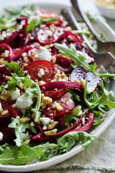 a salad with beets, feta cheese and walnuts