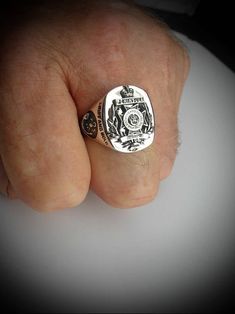 Royal Green Jackets Oxidized Sterling Silver Ring Face of Ring is 22mm high by 18mm wide. Our Bespoke Military Signet ring is a true modern classic, handcrafted in our Studio workshops by our skilled Silversmith Artisans in solid sterling silver with oxidized emblem on a highly polished background. This unique Military Signet ring has a wonderful comfort fit and is perfect for men. You also have the option of having it engraved and personalized with initials,surname and military number on the in Classic Skull Ring As Gift With Polished Finish, Classic Skull Ring Gift, Classic Sterling Silver Skull Ring With Polished Finish, Classic Polished Skull Ring Collectible, Classic Handmade Rings, Classic Formal Skull Ring With Polished Finish, Classic Polished Skull Ring For Anniversary, Classic Skull Ring For Anniversary, Army Rings