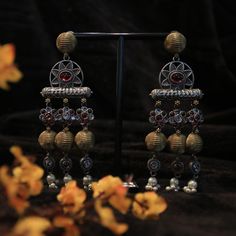 These stunning Brass and Oxidized Jhumkas will elevate any outfit with their unique design and high-quality materials. The beautiful brass complements the oxidized finish, creating a bold and eye-catching look. Perfect for adding a touch of elegance and sophistication to any ensemble. Oxidized Brass Jhumkas, Luxury Oxidized Finish Dangle Earrings, Ornate Oxidized Finish Earrings For Festive Occasions, Elegant Black Oxidized Finish Earrings, Ornate Oxidized Brass Earrings, Dangler Earrings, Organza Sarees, Tussar Silk Saree, Finger Rings