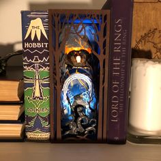 a candle and some books on a table