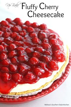 a close up of a cake with cherries on it and the words fluffy cherry cheesecake