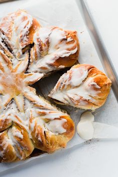 cinnamon roll snowflake bread with icing on top