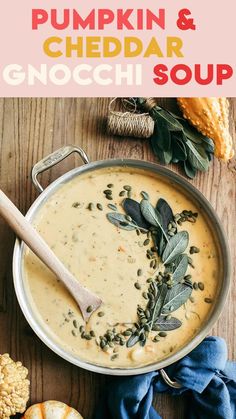 pumpkin and cheddar gnocchi soup in a pan with herbs on top