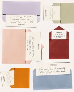 several different colored envelopes with writing on them