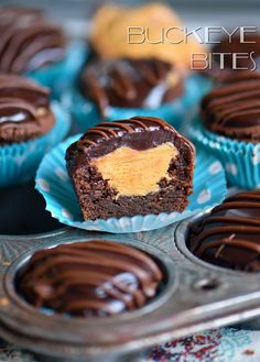 chocolate cupcakes with peanut butter frosting in a muffin tin, ready to be eaten