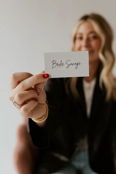 a woman holding up a piece of paper with the word bubble song written on it