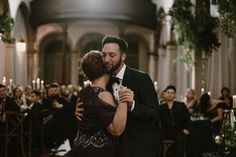 a man and woman dance together in front of an audience