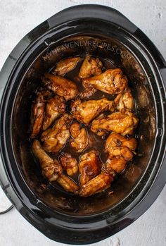 the chicken is cooking in the slow cooker