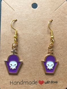 WE HAVE A TON OF OTHER HALLOWEEN EARRINGS AND ACCESSORIES!   https://www.etsy.com/shop/BeautifulByTheBauers?ref=shop-header-name&listing_id=1563599230&section_id=44696796 Check out the rest of our Etsy shop : ) Introducing our bewitchingly delightful Purple Tombstone Earrings - the perfect accessory to enchant your Halloween look! These handcrafted earrings capture the playful spirit of the season while adding a touch of spooky charm to your ensemble. Each earring features a spooktacular tombsto Purple Metal Jewelry For Halloween, Purple Novelty Jewelry For Pierced Ears, Purple Halloween Jewelry Gift, Purple Earrings As Halloween Gift, Purple Earrings For Halloween Gift, Earrings Purple, Witch Costume, Halloween Looks, Halloween Earrings