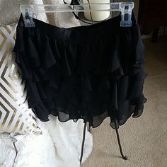 Beautiful Ruffle Mini Skirt With Satin Band Waist. Very Dressy And Flowy Ruffled Mini Skort For Night Out, Spring Ruffled Skort For Night Out, Fitted Ruffle Skort For Night Out, Fitted Ruffles Skort For Night Out, Black Bottoms With Ruffle Hem For Party, Black Party Bottoms With Ruffle Hem, Ruffle Hem Skirt For Night Out, Black Bottoms With Ruffle Hem For Night Out, Flirty Black Ruffled Bottoms