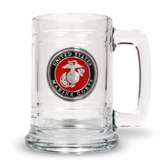 a glass mug with the marine seal on it's front and side is shown