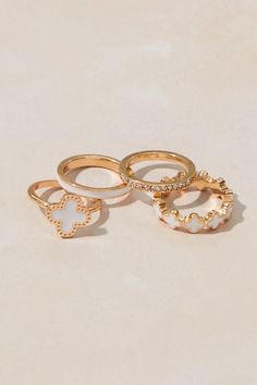 Enamel Clover Ring Set in Gold & White | Altar'd State Rings Preppy, Delicate Gold Chain, Clover Ring, Multiple Rings, Clover Bracelet, Sophomore Year, Gold Ring Sets, Jewelry Essentials