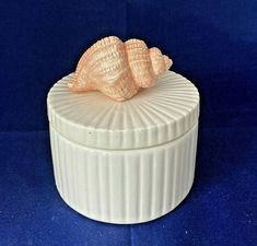 vtg Fitz and Floyd Coquille Ceramic Lidded Box Jar 3 1/2" round - white with peach colored conch shell - perfect in bathroom for storing sundries - or as a trinket box I have 3 other pieces listed and would gladly combine shipping 3 1/2 inch tall overall 3 1/2 inch across weighs 7 oz. marked on bottom : Fitz and Floyd Inc MCMLXXVI FF made in Japan in 1976 pre-owned - just stored away Condition ~  terrific used not abused condition - clean - lid edge shows a little extra blob of glaze - see last close-up pic -  no chips, cracks or damage - Happy to answer questions or send more photos - check out my other items and save with combined shipping! Thanks for looking. Speedy WORLDWIDE  SHIPPING - within 24 hrs after payment Limited Intl insurance included in regular not flat rate Priority & Expr Ceramic Conch Shell, Cute Clay Containers, Pinch Pot With Lid, Slab Box Ceramics, Conch Shell Decor, Pottery With Lid, Friend Painting Ideas, Ceramic Lidded Jars, Clay Pinch Pots