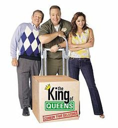 the king of queens is standing next to two women and a cart full of food