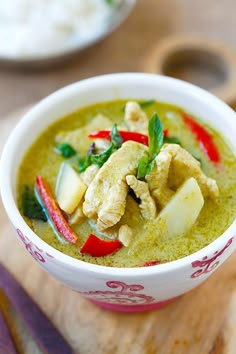 green curry with chicken and vegetables in a bowl