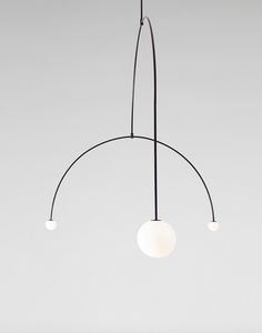 three lights hanging from the ceiling in a room