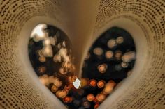 the reflection of two heart shaped books in each other's eyes