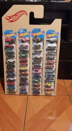 the hot wheels display case is filled with all kinds of toy cars in it's boxes