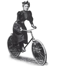 an old photo of a woman riding a bicycle