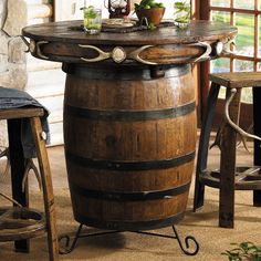 a wooden barrel table sitting on top of a floor