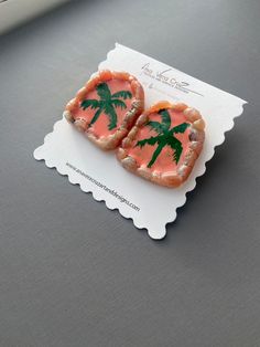 two pieces of food with palm trees on them