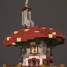 a small house made out of legos on top of a hill