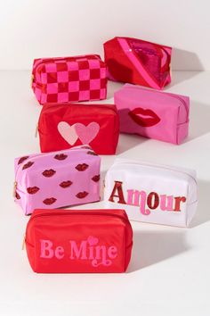 Carry all your odds and ends in style with Shiraleah's Cara "Be Mine" Zip Pouch. Made of durable polyester in a bright red color, this rectangular case is the perfect size to carry your makeup or toiletries on the go. The trendy pink sequin embroidery spells the words "Be Mine", adding a little love wherever you take it. Pair with other items from Shiraleah to complete your look! Features a top zip closure and embroidered lettering Shiraleah is a trend-driven lifestyle brand focused on the littl Spa Wraps, Embroidered Lettering, Accessories Display, Sequin Embroidery, Sequin Design, Odds And Ends, Toiletry Pouch, Sequins Embroidery, Pink Sequin