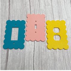 three different colors of wood with the letter b on them