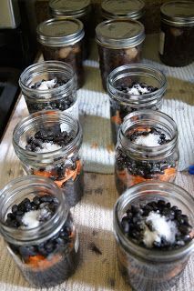 several jars filled with food sitting on top of a table