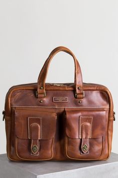 Americana CEO Leather Briefcase with Concealed Carry Pocket | Overland Cool Messenger Bags, Leather Business Bag, Bison Leather, American Bison, Rustic Texture, Horween Leather, Leather Travel Bag, Wallet Organization, Business Bag