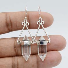 Crystal Quartz Earrings, Clear Crystal Point Earring, Dangle Earrings, Anniversary Earring, Gift for Her, Statement Earring, Boho Jewelry. 》D E T A I L S《 ✦Stone: Crystal Clear Quartz ✦Shape: Pencil ✦Size: 8x22 mm ✦Weight:-  8.50 Gram Approx ✦SKU: SE-1520 》A B O U T S T O N E《 ♥ It is believed that mankind has a deep connection with quartz, the most common crystal on Earth. ♥ It carries a very loving and sweet energy, stimulating the spirit and elevating one's mood. ♥ Meditating with this crystal allows one to enter a state of serenity and peace, purification and rest, and to go beyond the body to perceive and receive help from one's angel guides. 》C U S T O M I Z E O R D E R《 We accept custom and personalized order. It can be change in the gemstone, earring design and earring size. Please Crystal Quartz Earrings, Earring Dangle, Earring Gift, Statement Earring, Earrings Crystal, Stone Crystal, Earrings Stud, Quartz Earrings, White Quartz