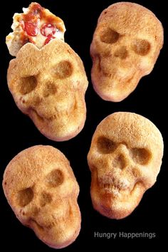 three skull shaped pastries with different toppings