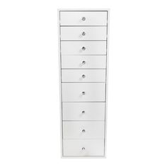 a tall white drawer with five drawers on each side and four knobs at the top