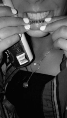 black and white photograph of a woman brushing her teeth