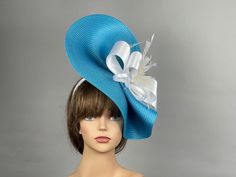 It is my own unique design. This headband is perfect for horse racing events, church, the Kentucky derby, weddings, garden tea parties and charity events. Please visit my other shop https://www.etsy.com/shop/BridalWorldAccessory?ref=hdr_shop_menu Thank you for shopping at my shop Have a great day Light Blue Headpiece For Kentucky Derby Party, Light Blue Mini Hat For Kentucky Derby Party, Elegant Turquoise Fascinator For Kentucky Derby, Elegant Turquoise Fascinator For Races, Blue Adjustable Fascinator For Gift, Blue Headband Hat For Kentucky Derby, Blue Summer Headband Costume, Blue Mini Hats As Summer Gifts, Blue Mini Hats As Gifts For Summer