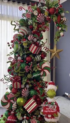 a christmas tree decorated with candy canes and ornaments